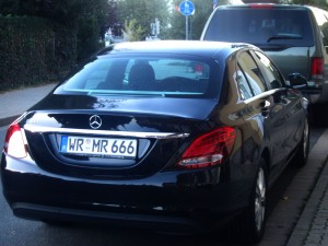 Black car, license plate WR MR 666.